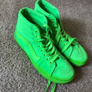 Neon green high-top Vans